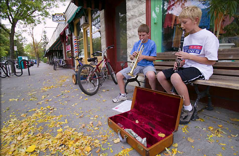 Young musicians give an impromptu concert outside a Boise, Idaho, shop.